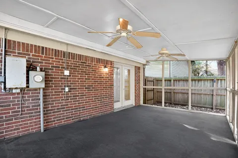 a view of a house with trees in the background