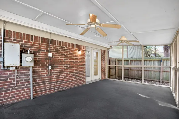 a view of a house with trees in the background