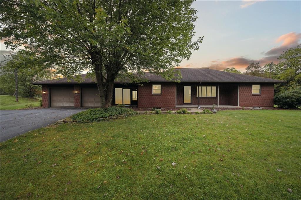 1662 Freeport Road Kittanning, PA 16201 - Photo 1 of 43 a front view of a house with a garden