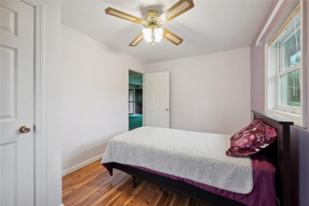 1662 Freeport Road Kittanning, PA 16201 - Photo 23 of 43 a bedroom with a bed and a chandelier