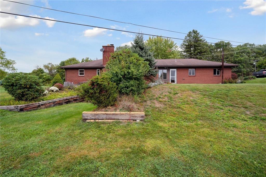 1662 Freeport Road Kittanning, PA 16201 - Photo 36 of 43 a front view of a house with a yard