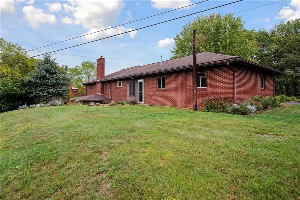 1662 Freeport Road Kittanning, PA 16201 - Photo 37 of 43 a backyard of a house with lots of green space