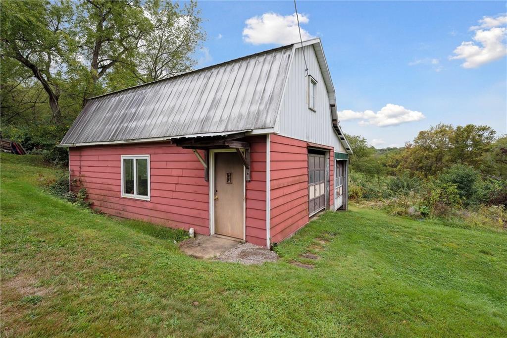 1662 Freeport Road Kittanning, PA 16201 - Photo 40 of 43 a front view of a house with a garden
