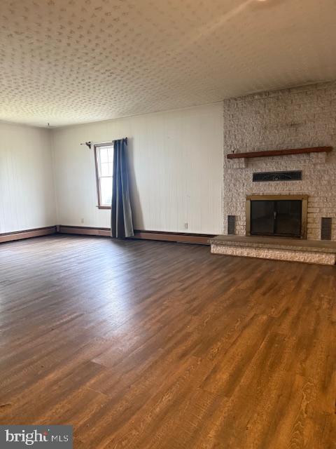 418 Church Street New Windsor, MD 21776 - Photo 4 of 20 a view of an empty room with wooden floor fireplace and a window