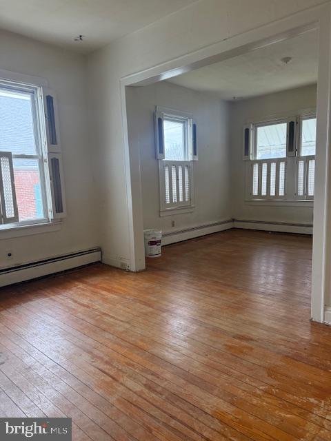 418 Church Street New Windsor, MD 21776 - Photo 9 of 20 a view of an empty room with wooden floor and a window