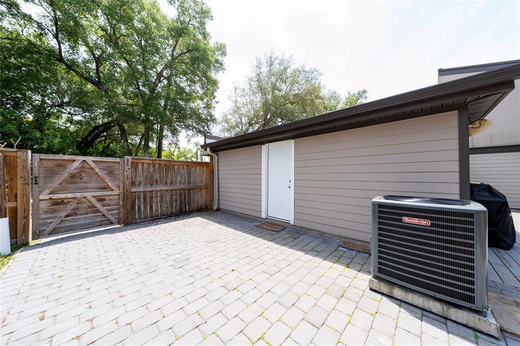 357 Ridgewood Street Altamonte Springs, FL 32701 - Photo 29 of 36 a backyard of a house with wooden fence and trees
