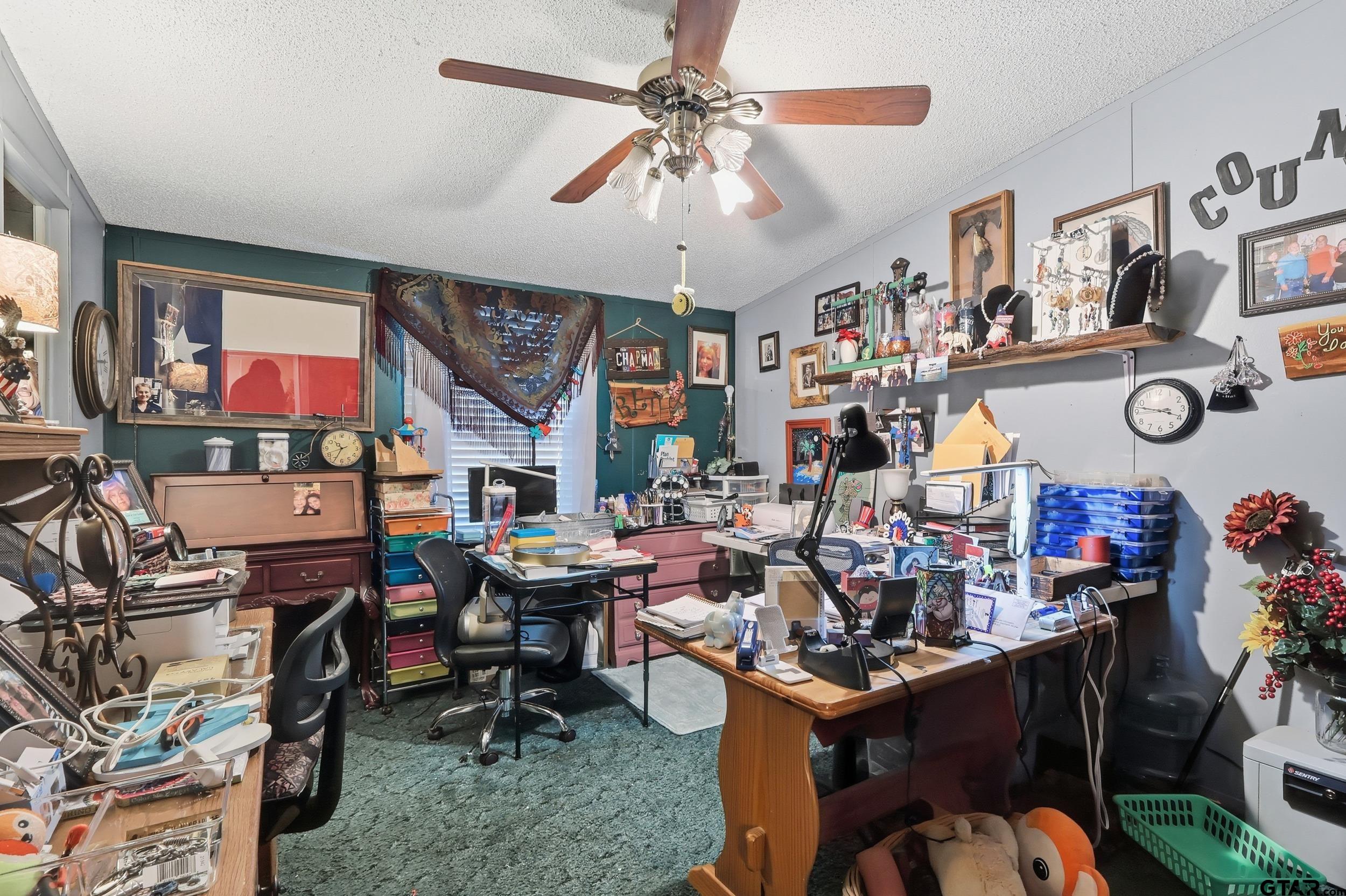 264 County Road 2169 Quitman, TX 75783 - Photo 2 of 34 a view of a room with lots of furniture and lots of potted plants