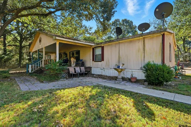 a view of a backyard with a small cabin