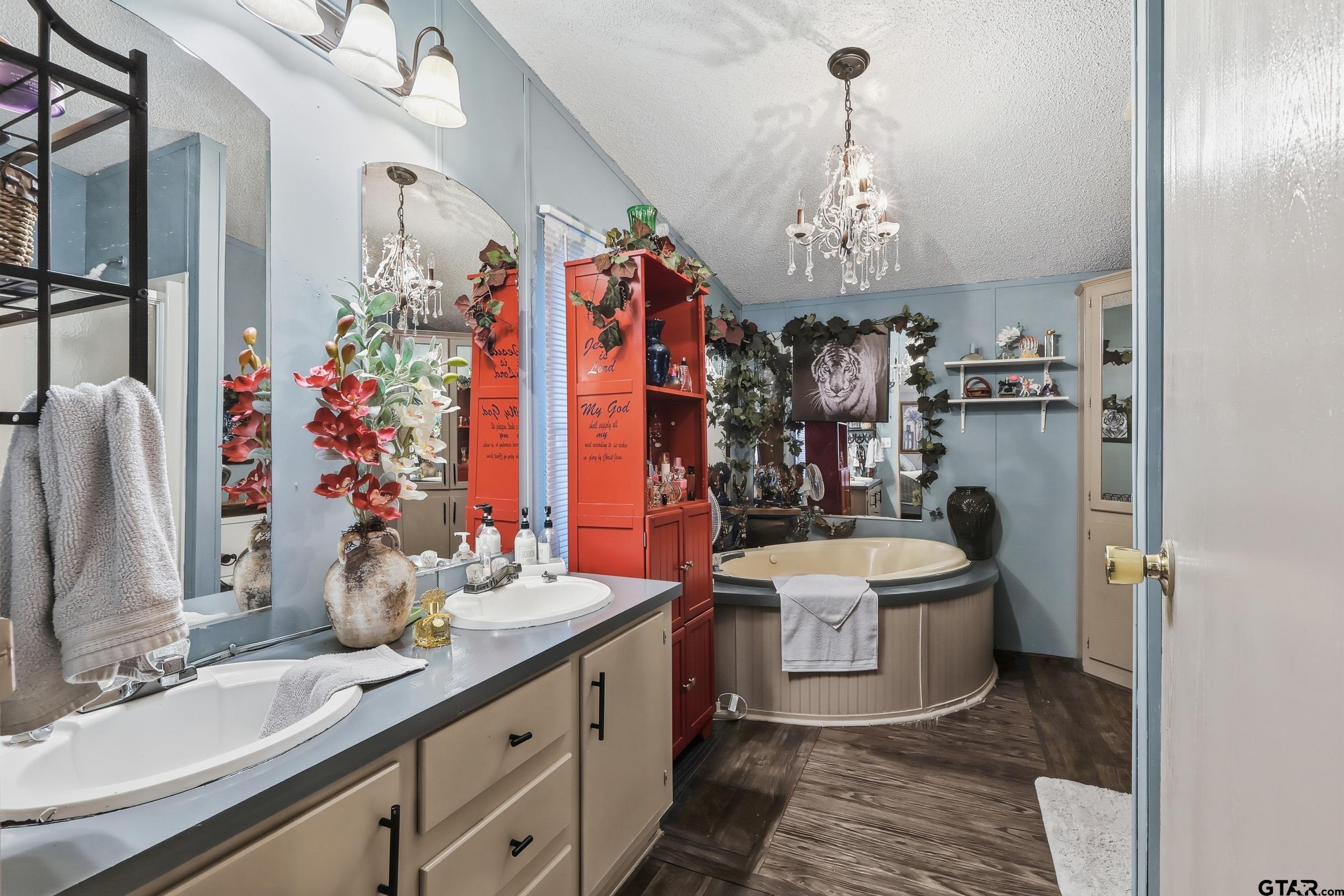 264 County Road 2169 Quitman, TX 75783 - Photo 33 of 34 a spacious bathroom with a double vanity sink mirror and double