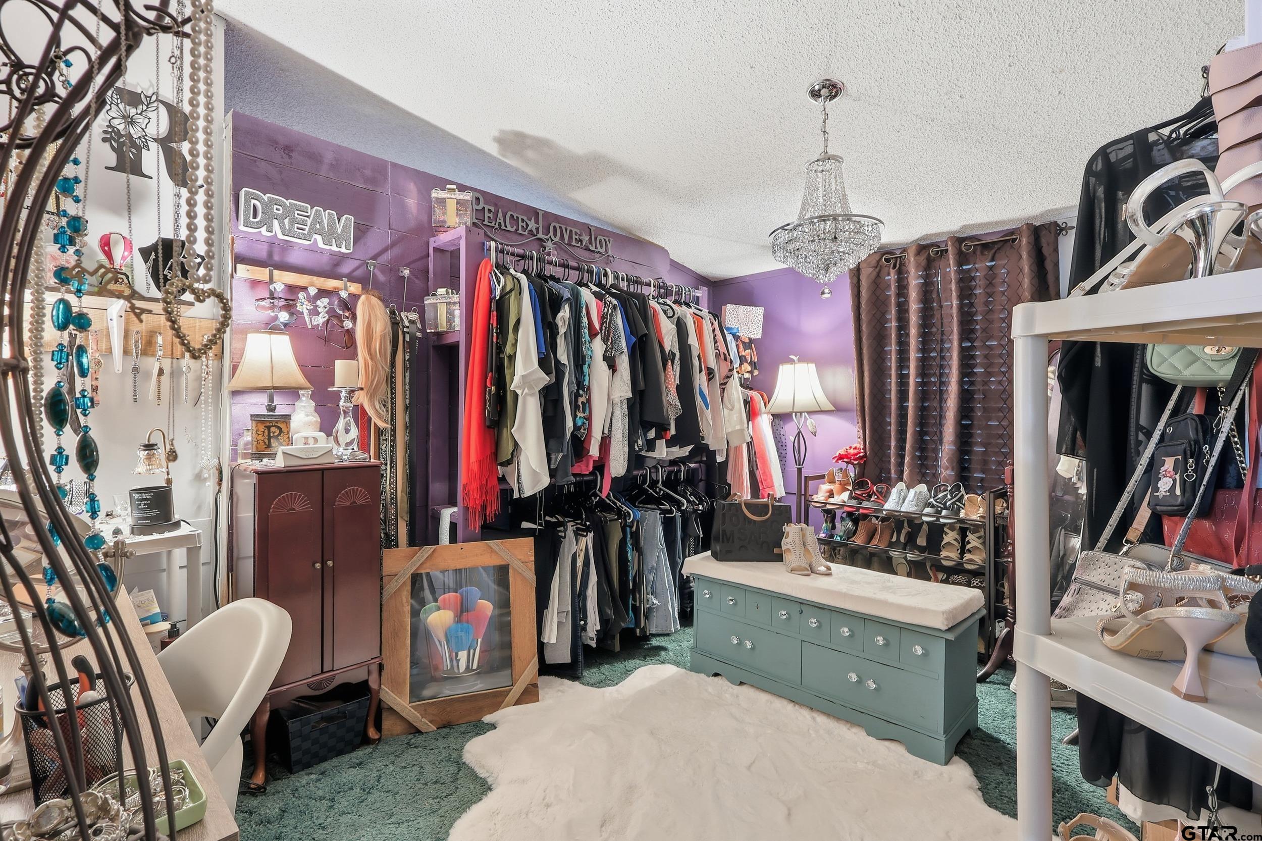264 County Road 2169 Quitman, TX 75783 - Photo 34 of 34 a view of walk in closet with clothes and shoes