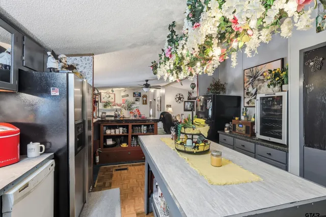 a view of a dining room with furniture and chandelier