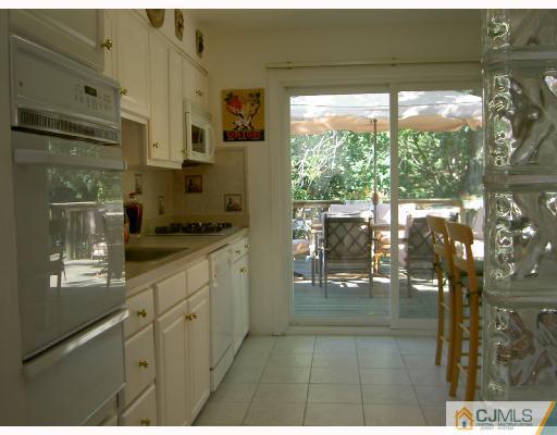 4 Kings Road East Brunswick, NJ 08816 - Photo 5 of 9 a open kitchen with granite countertop a view of living room