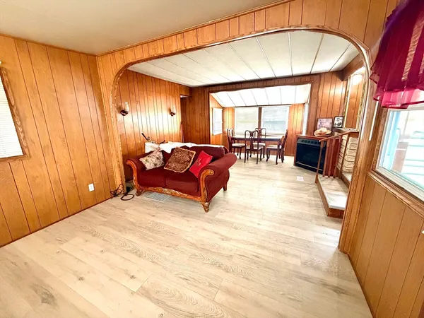 a living room with furniture a window and a table