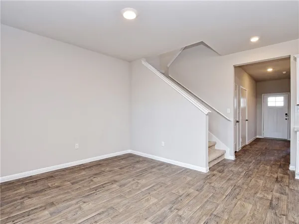 a view of entryway with wooden floor