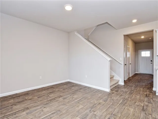 a view of entryway with wooden floor