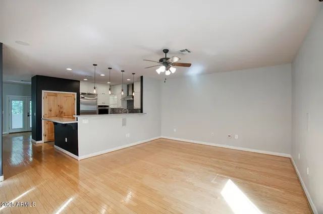 a view of kitchen with cabinets and wooden floor