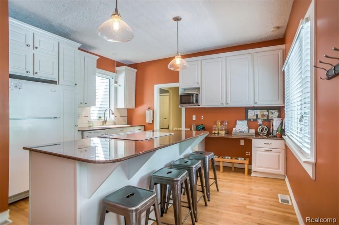 722 North State Street Howell, MI 48843 - Photo 12 of 27 Wonderful kitchen with hardwood flooring