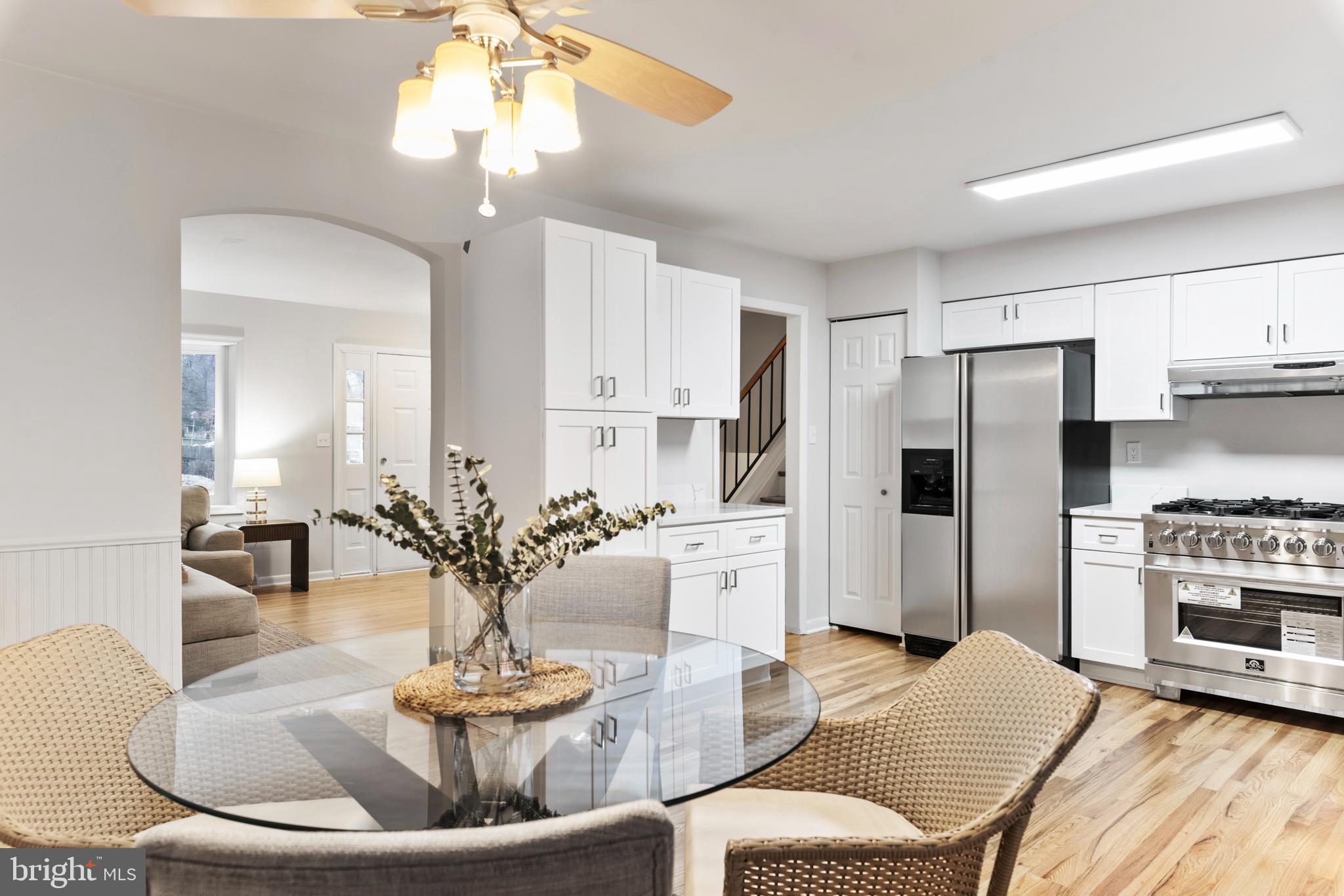 125 Pinecrest Drive Annapolis, MD 21403 - Photo 13 of 69 a living room with fireplace furniture and a dining table with kitchen view