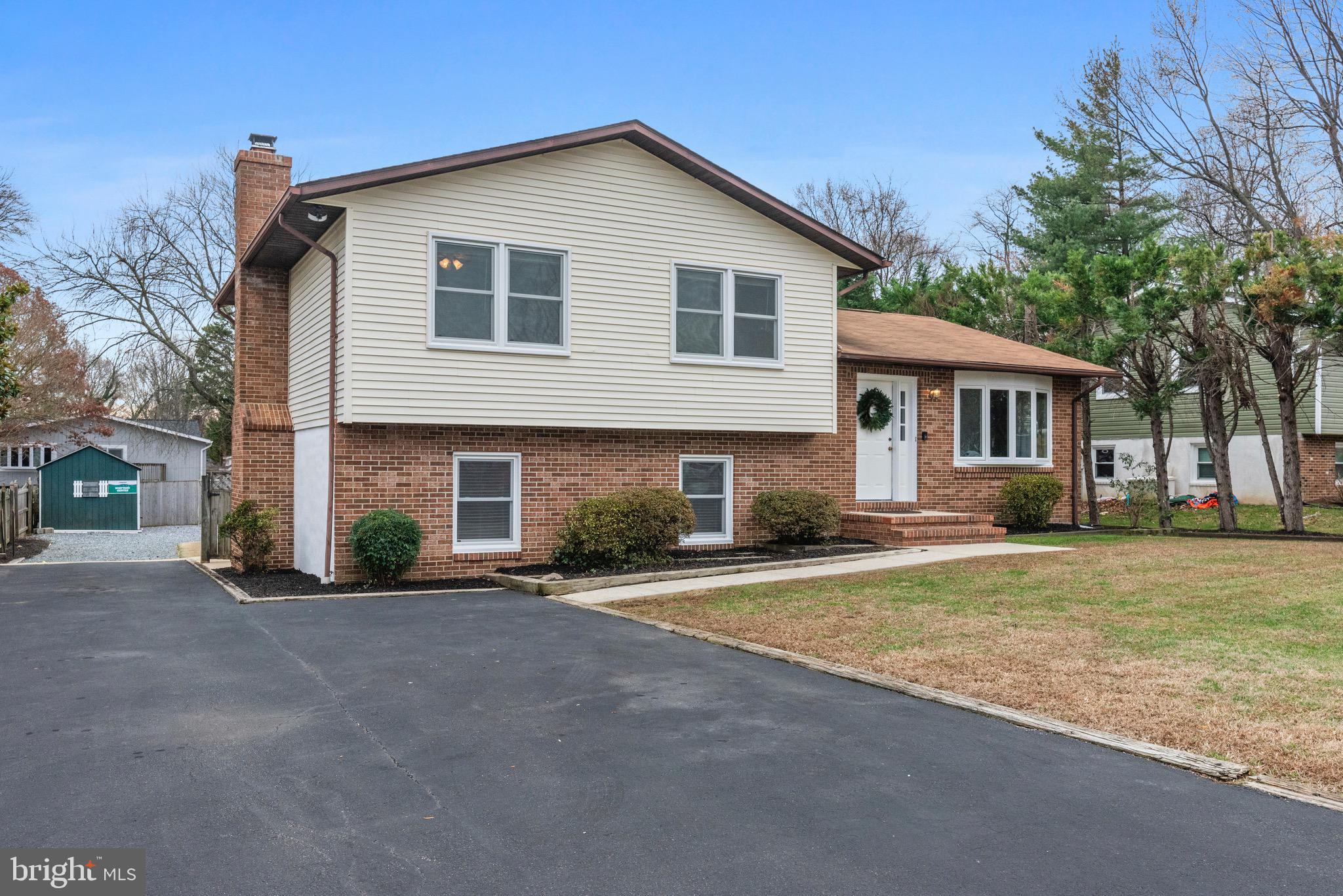 125 Pinecrest Drive Annapolis, MD 21403 - Photo 2 of 69 a front view of a house with a yard and garage