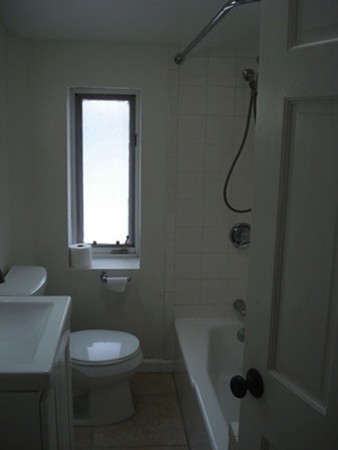 12 Playstead Road, Unit 3 Boston, MA 02125 - Photo 2 of 6 a bathroom with a sink a toilet and shower