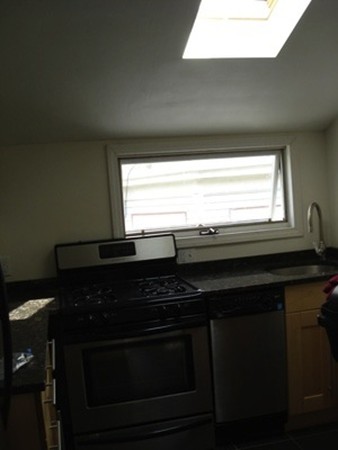 12 Playstead Road, Unit 3 Boston, MA 02125 - Photo 6 of 6 a close view of kitchen appliances and window