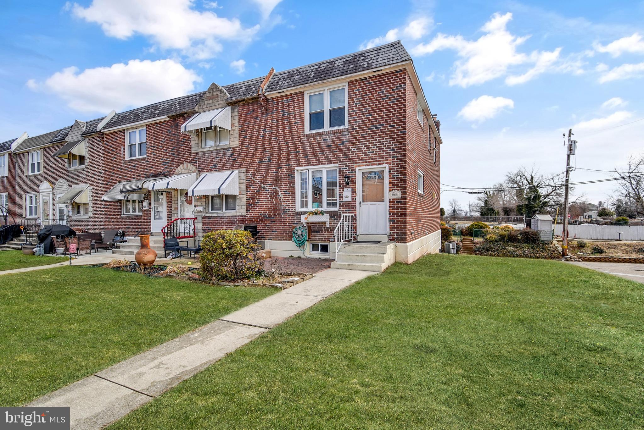 666 Rively Avenue Glenolden, PA 19036 - Photo 15 of 15 a view of a yard in front of a brick house