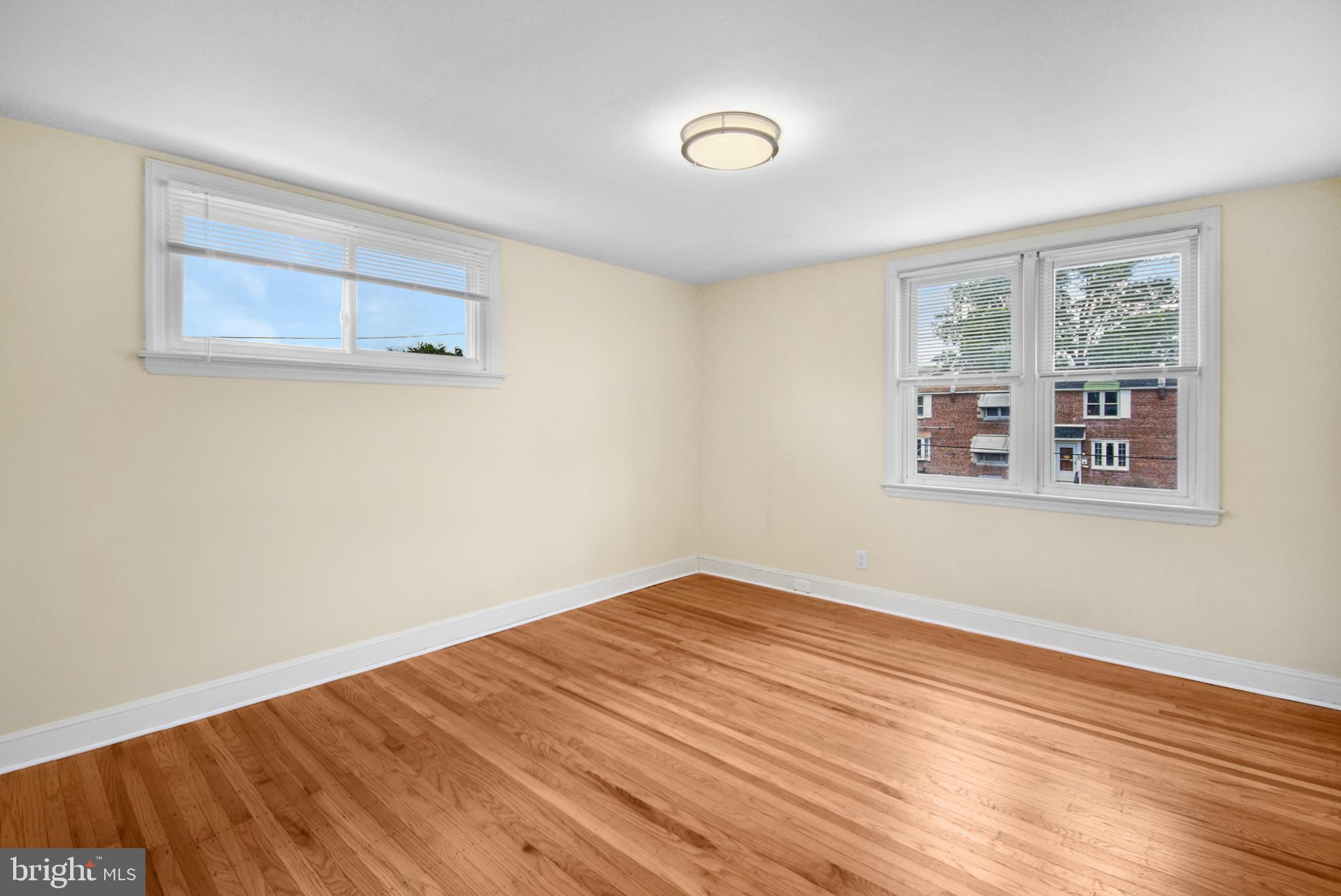 666 Rively Avenue Glenolden, PA 19036 - Photo 6 of 15 a view of empty room with wooden floor