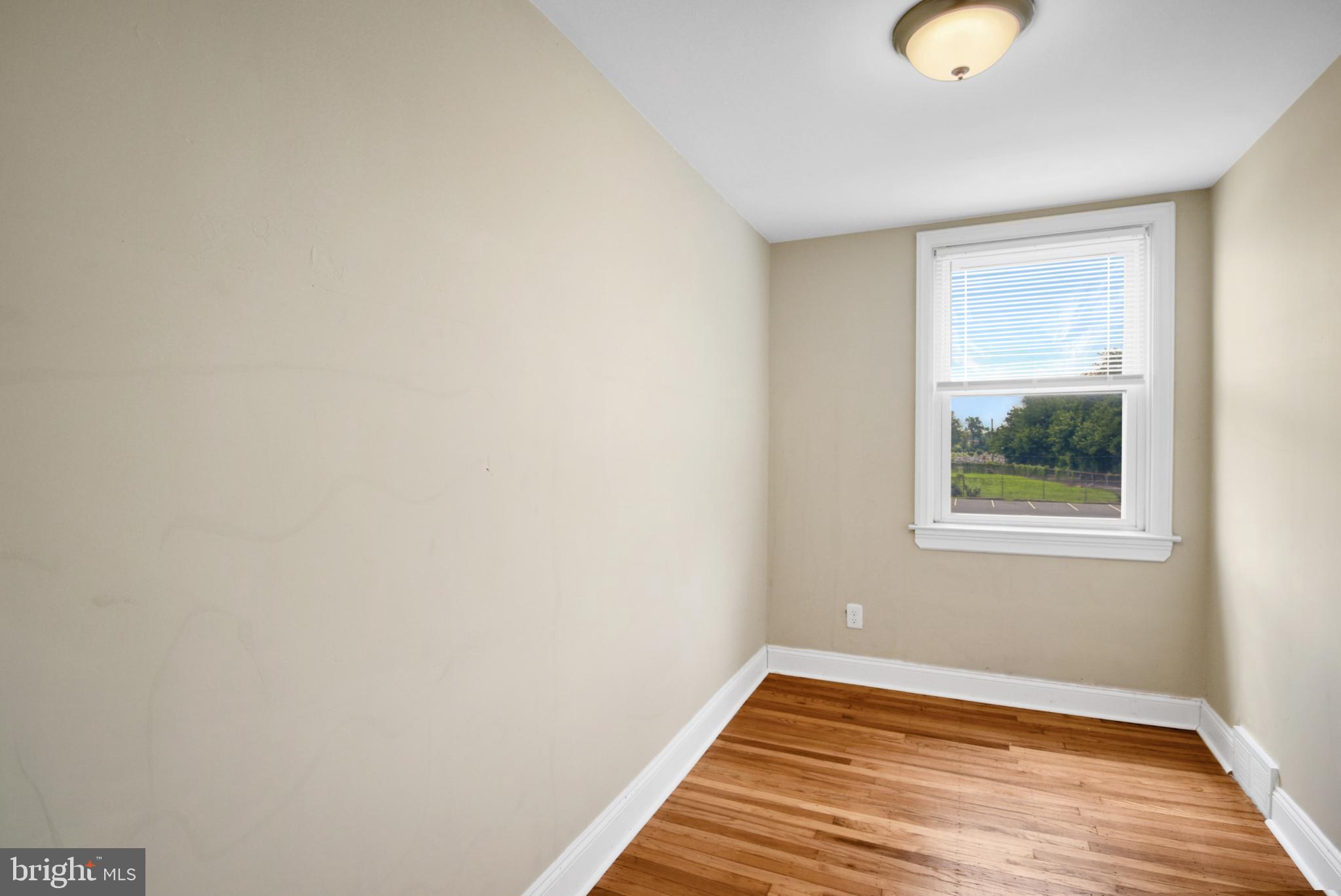 666 Rively Avenue Glenolden, PA 19036 - Photo 8 of 15 a view of a room with wooden floor and window