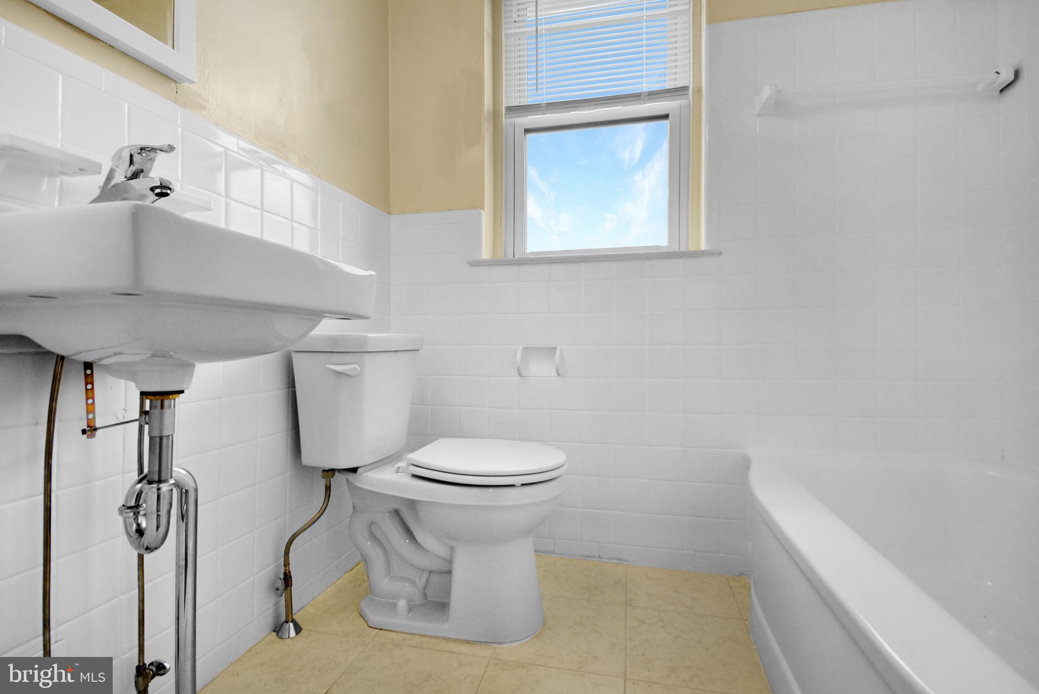 666 Rively Avenue Glenolden, PA 19036 - Photo 9 of 15 a bathroom with a toilet sink and shower