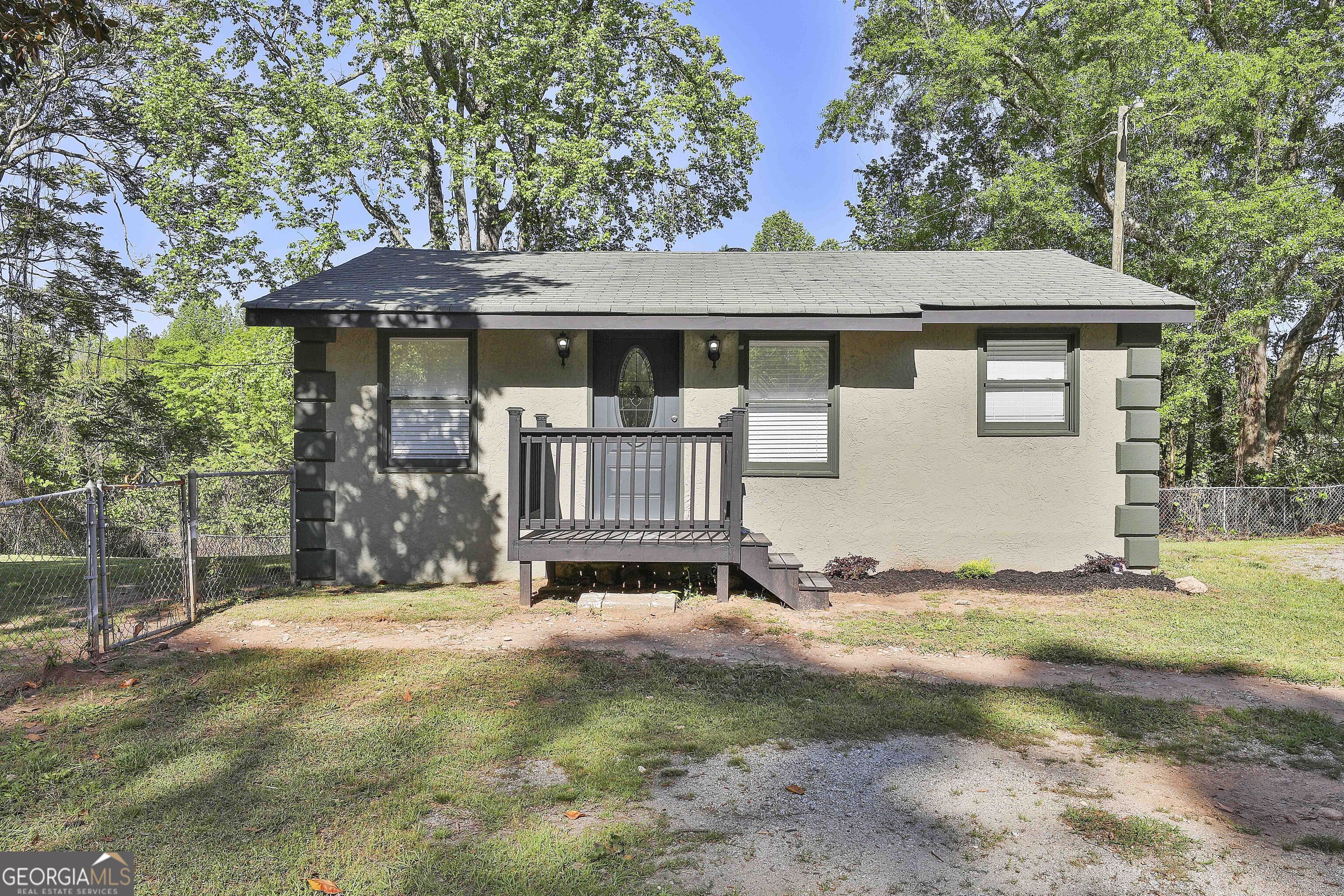 2225 Roscoe Road Newnan, GA 30263 - Photo 1 of 1 a front view of a house with a yard