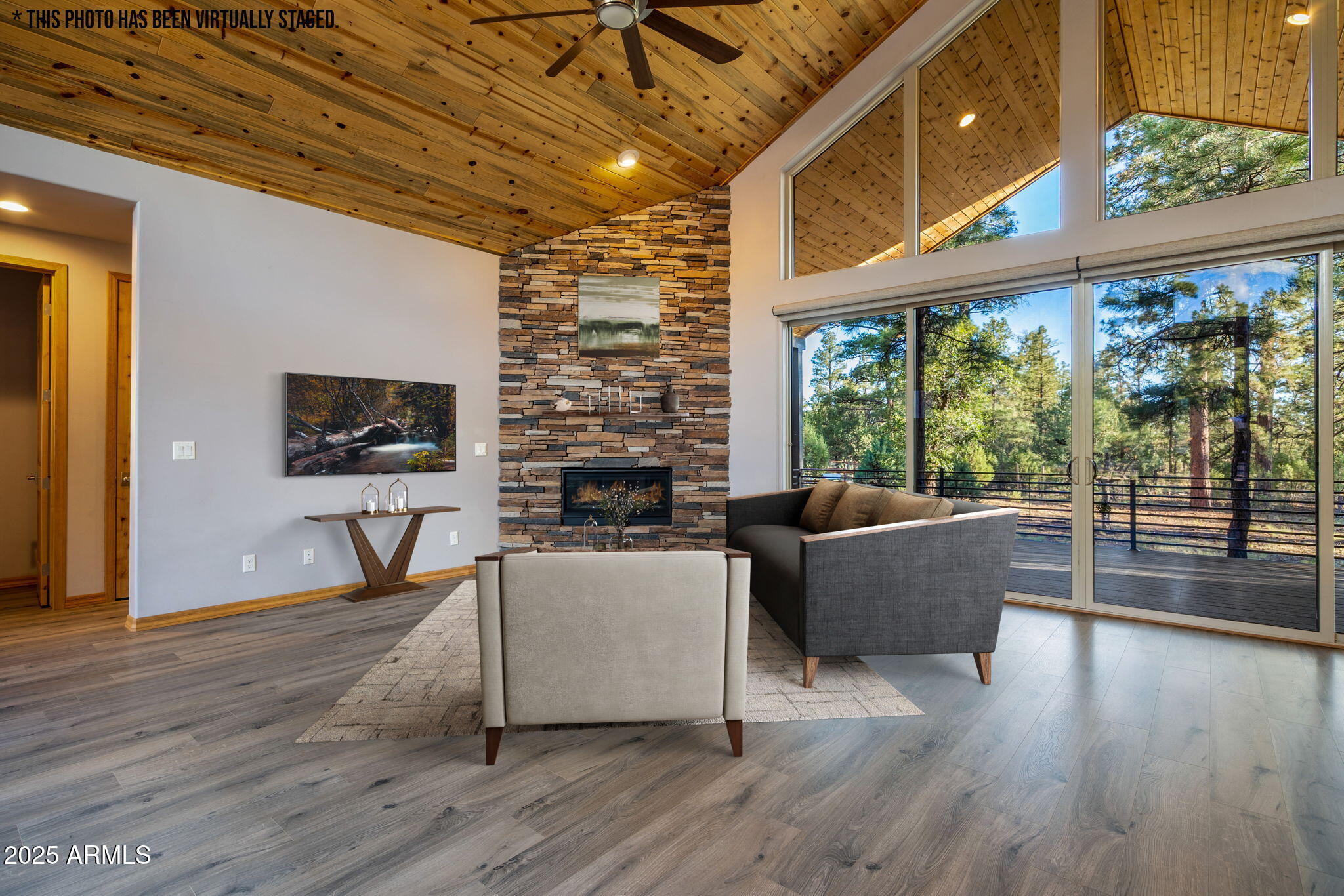 3429 Ponderosa Loop Heber, AZ 85928 - Photo 13 of 75 a living room with furniture a flat screen tv and floor to ceiling windows