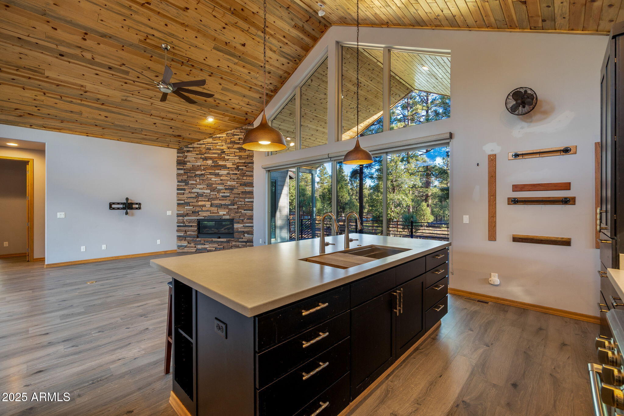 3429 Ponderosa Loop Heber, AZ 85928 - Photo 21 of 75 a kitchen with a wooden floor and a large window