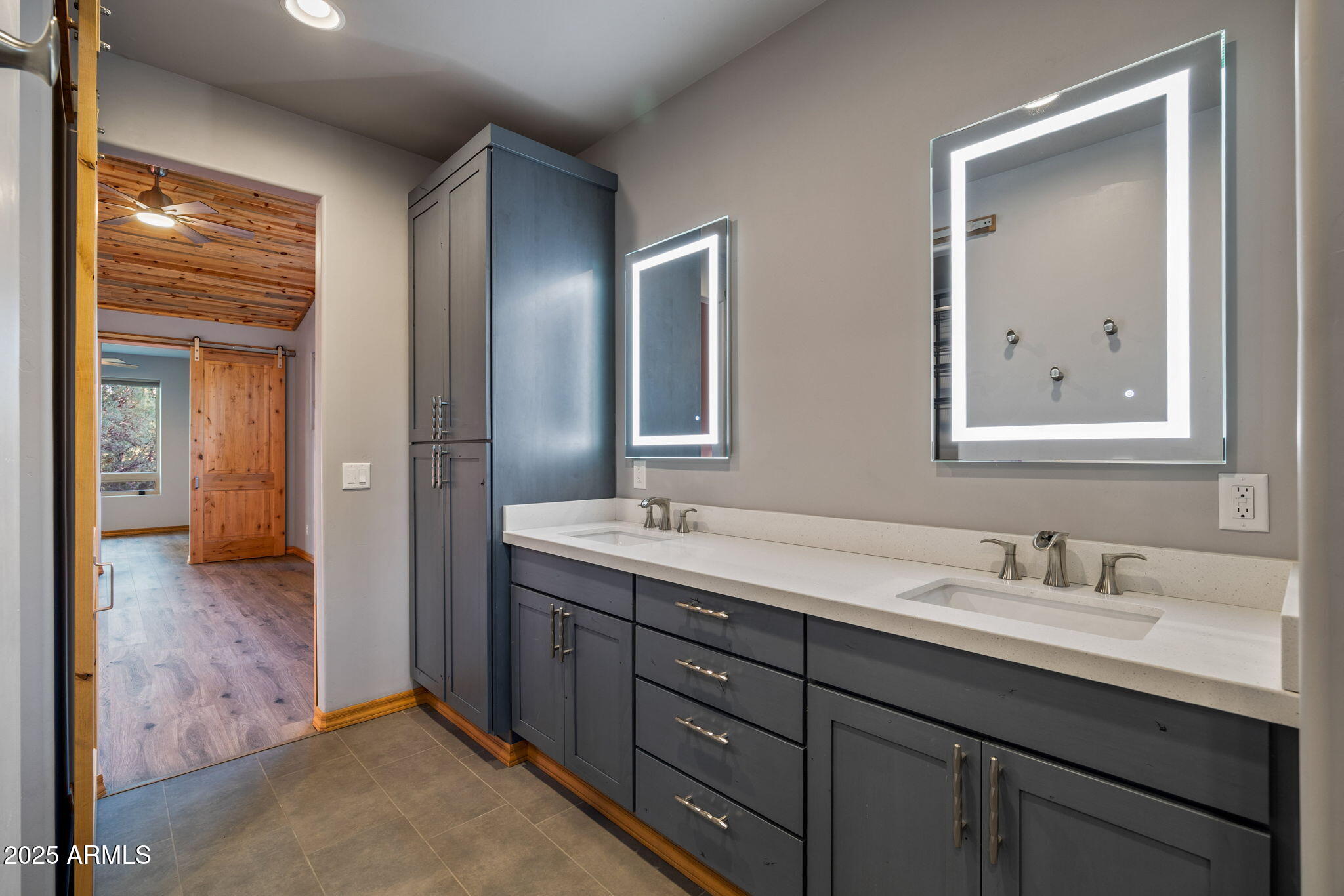 3429 Ponderosa Loop Heber, AZ 85928 - Photo 30 of 75 a bathroom with double vanity sinks and a mirror