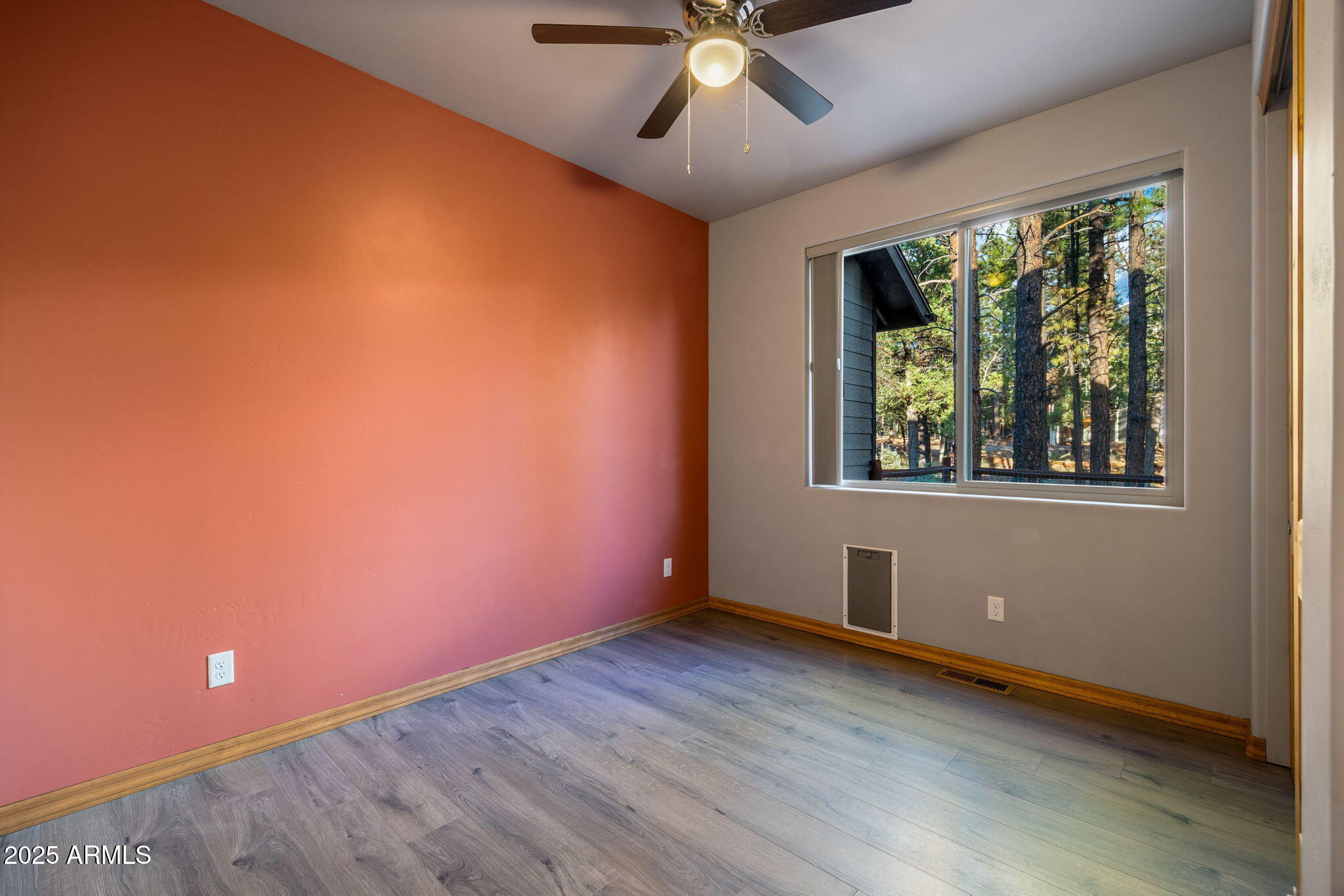 3429 Ponderosa Loop Heber, AZ 85928 - Photo 33 of 75 an empty room with wooden floor and windows