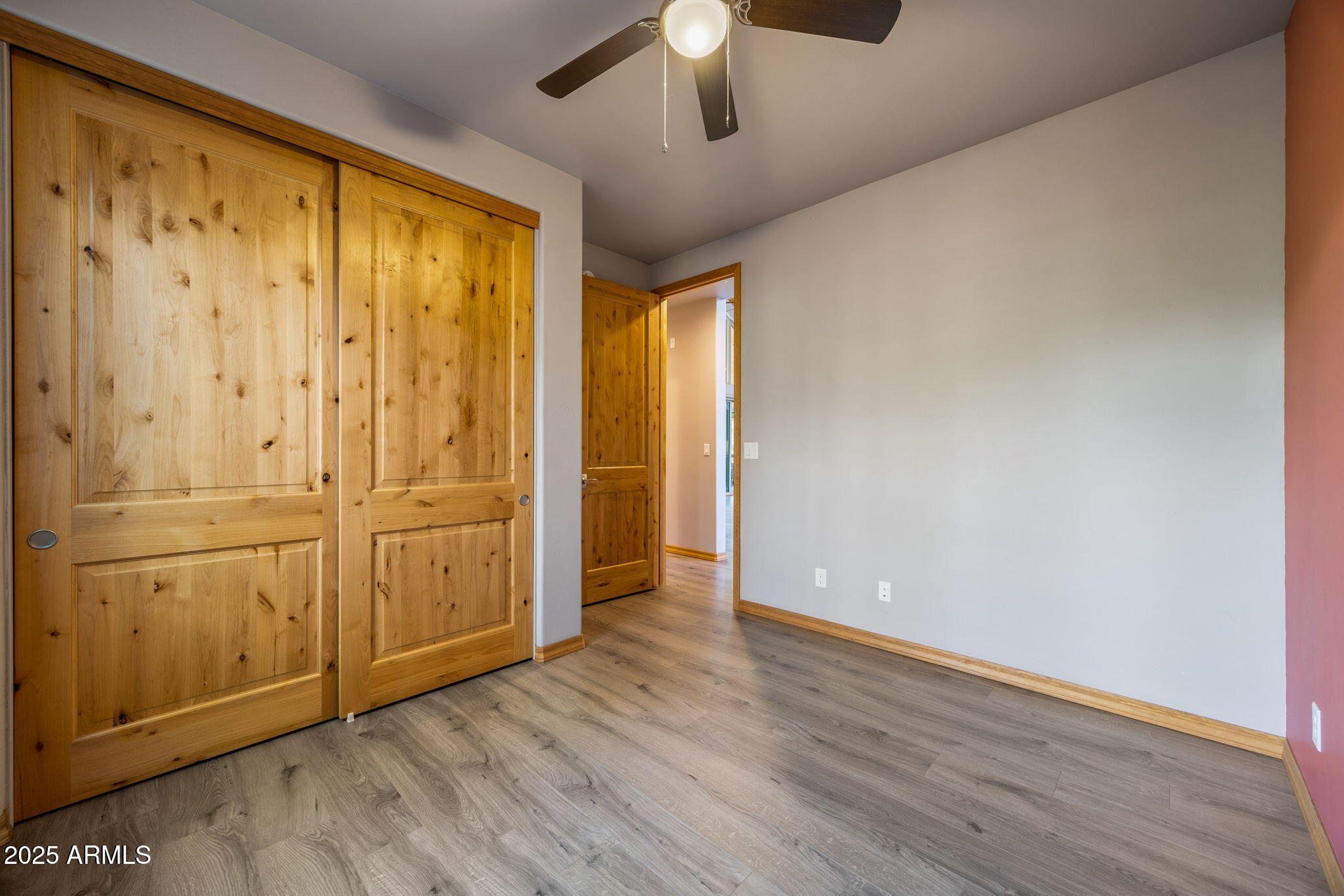 3429 Ponderosa Loop Heber, AZ 85928 - Photo 35 of 75 an empty room with wooden floor closet and windows