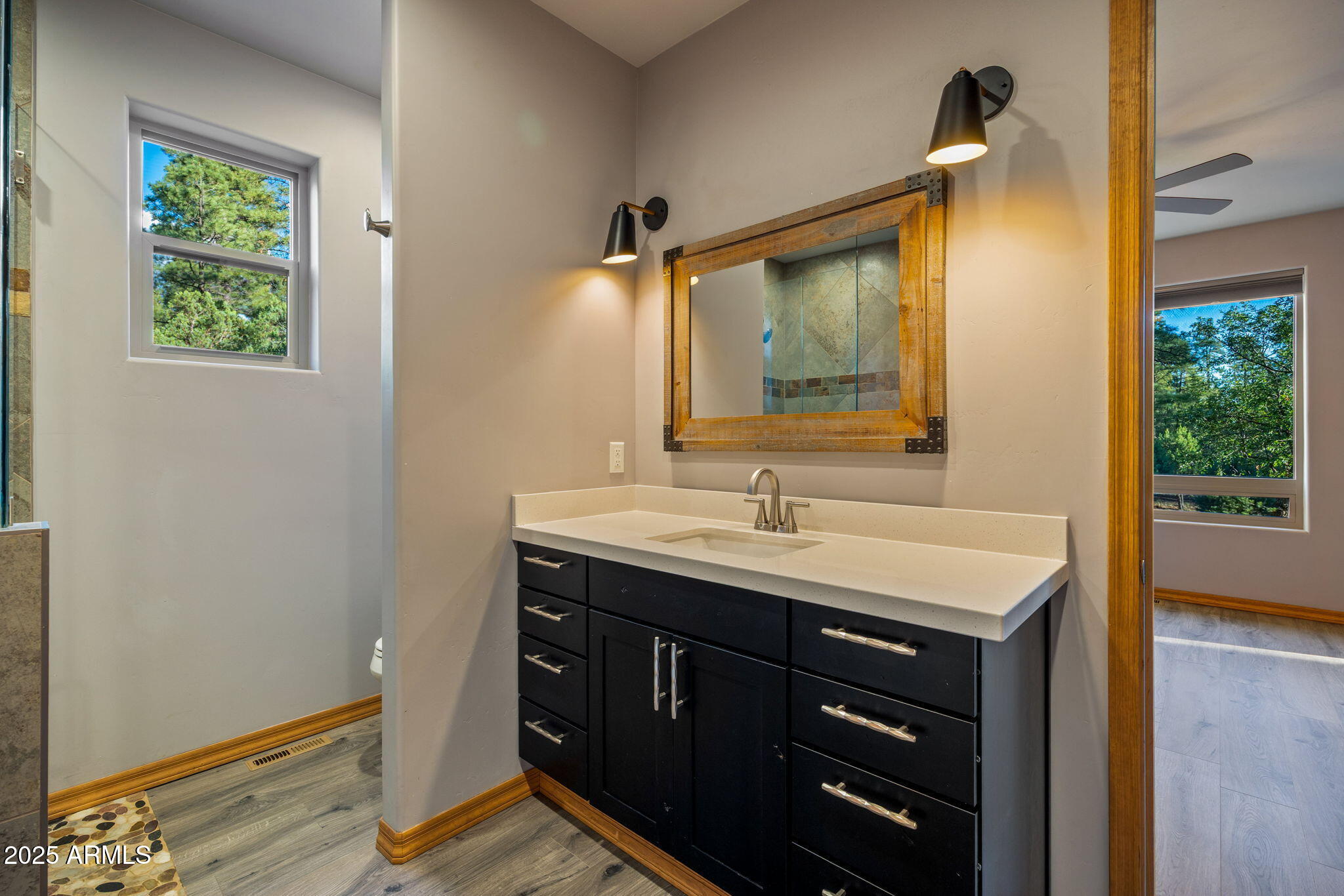 3429 Ponderosa Loop Heber, AZ 85928 - Photo 40 of 75 a bathroom with a sink a vanity and a mirror