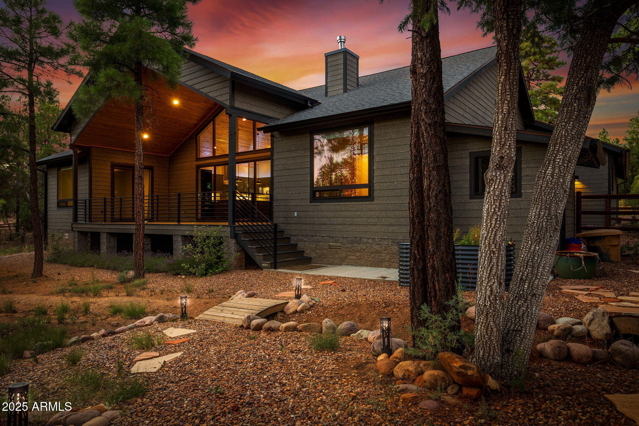 3429 Ponderosa Loop Heber, AZ 85928 - Photo 52 of 75 a view of a brick house with many windows next to a road