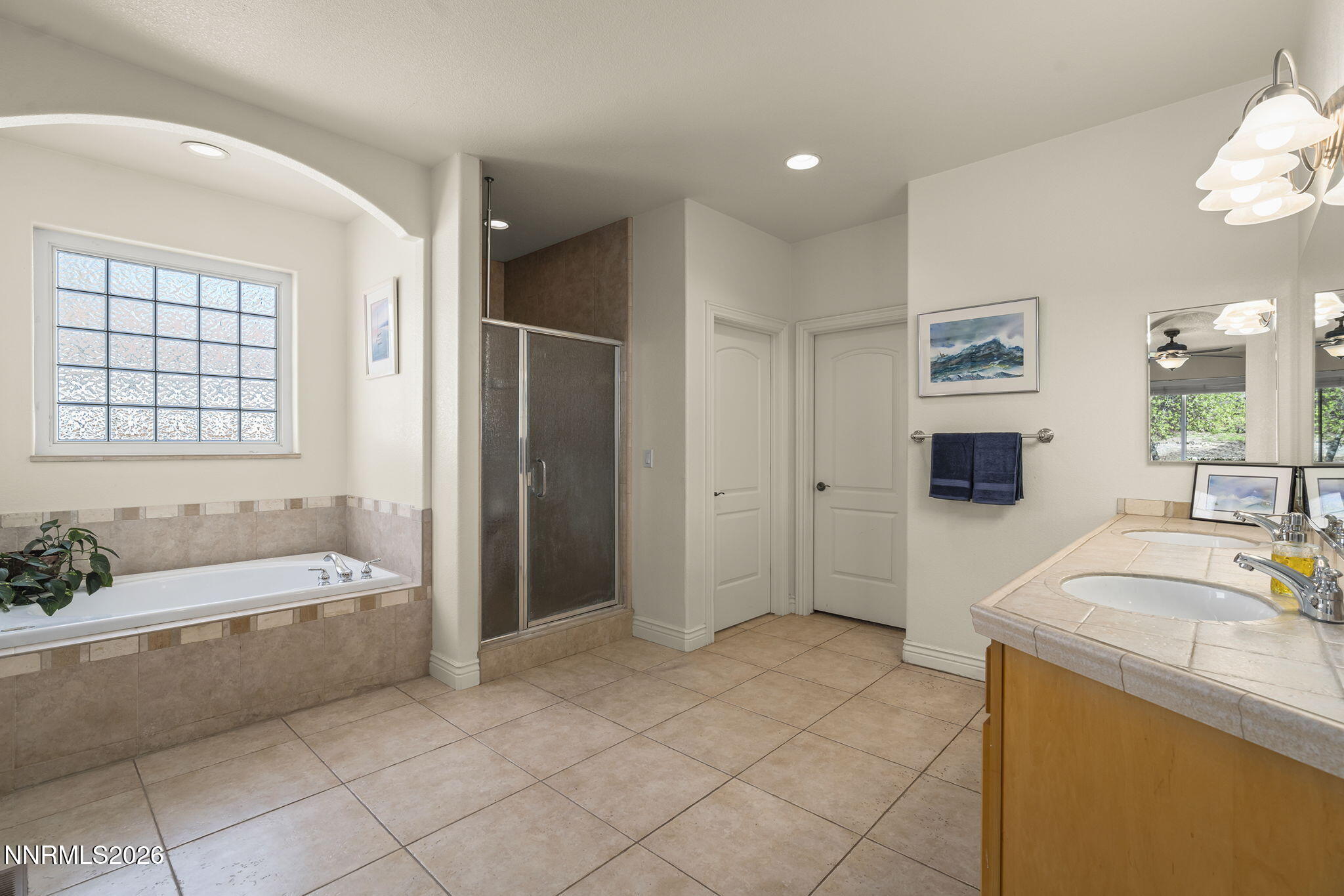 12635 Silver Wolf Road Reno, NV 89511 - Photo 30 of 48 a spacious bathroom with a tub sink and mirror