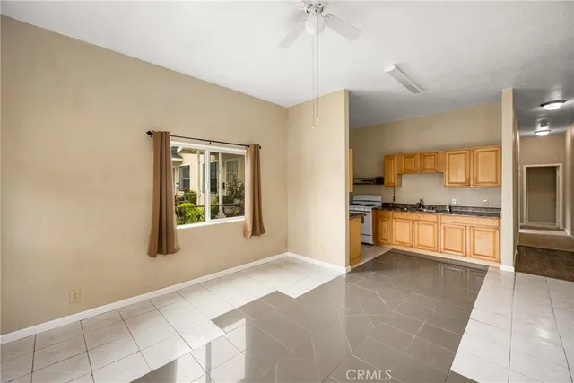 a large kitchen with cabinets and stainless steel appliances