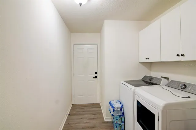 a view of storage and utility room with washer and dryer