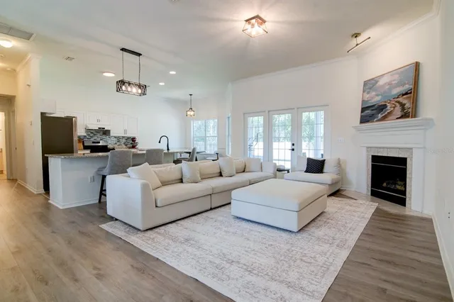 a living room with furniture and a fireplace