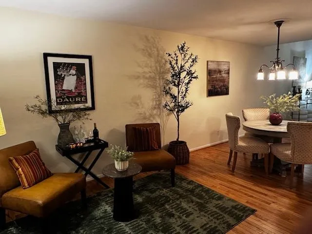 a bathroom with a granite countertop sink a toilet and mirror