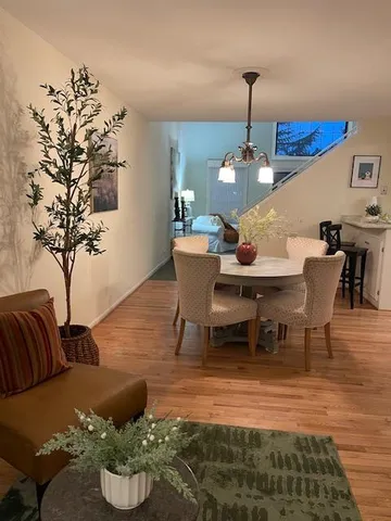 a bed room with a bed and a chandelier