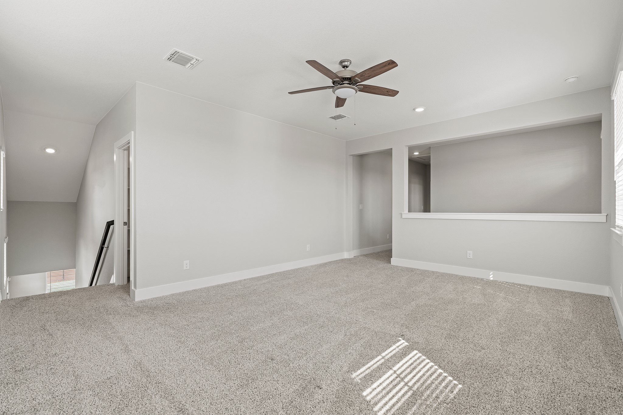2112 Tobiano Trace Georgetown, TX 78633 - Photo 29 of 40 Unfurnished room featuring recessed lighting, light colored carpet, and a ceiling fan