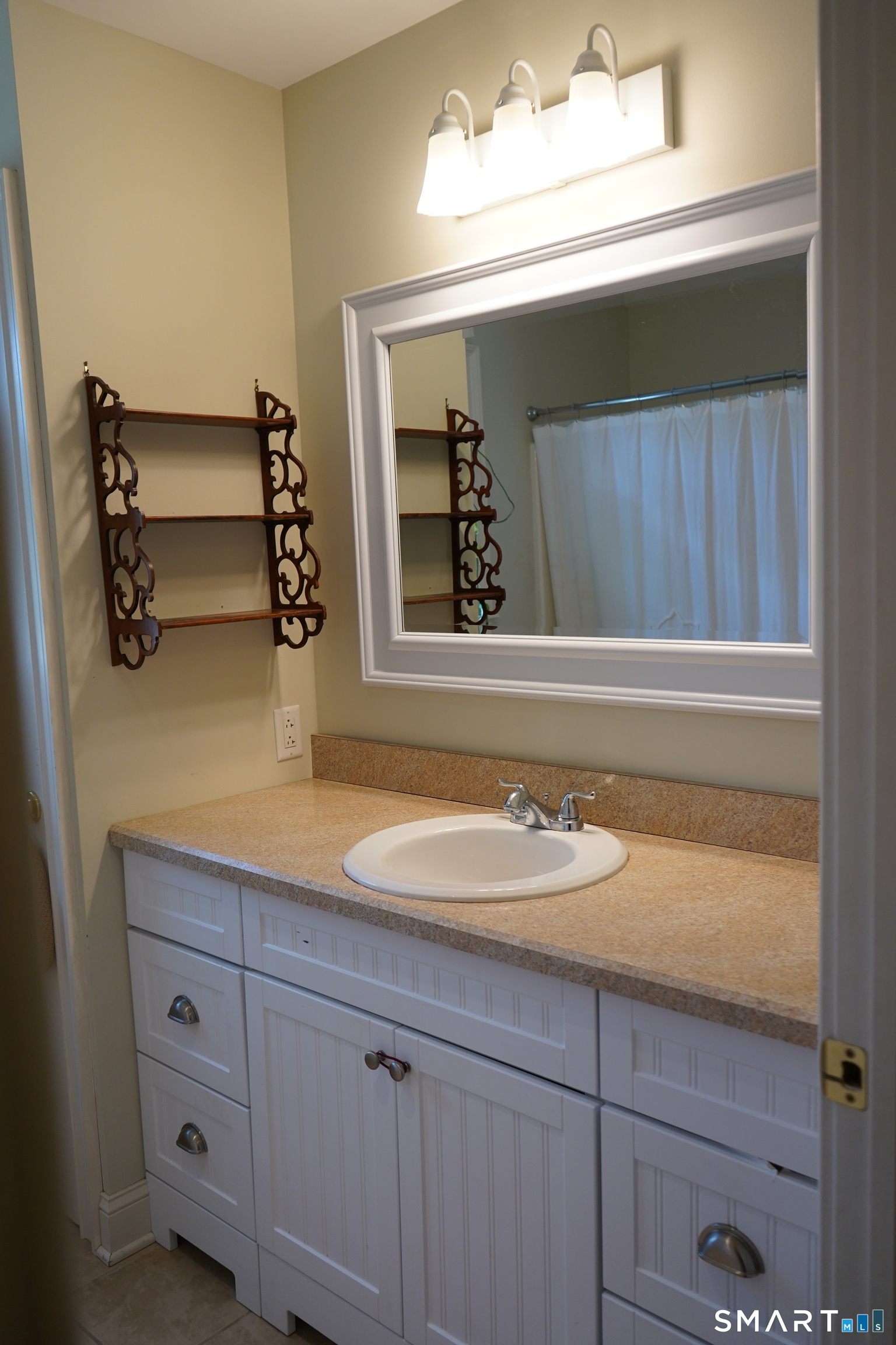 437 Providence Turnpike Hampton, CT 06247 - Photo 23 of 39 a bathroom with a sink and two mirror