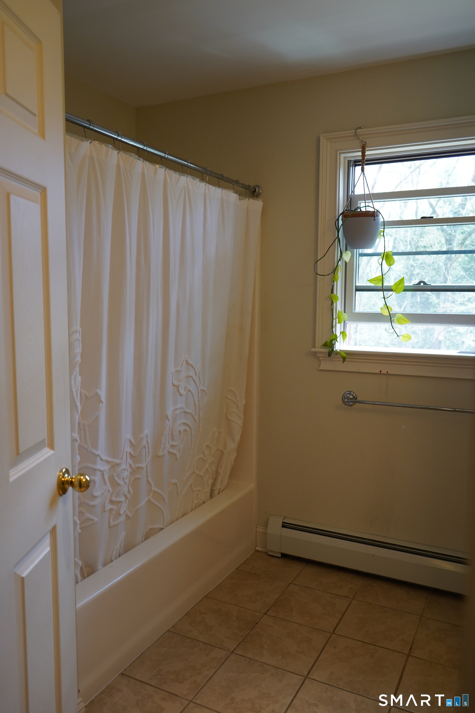 437 Providence Turnpike Hampton, CT 06247 - Photo 24 of 39 a view of a bathroom with a shower curtain