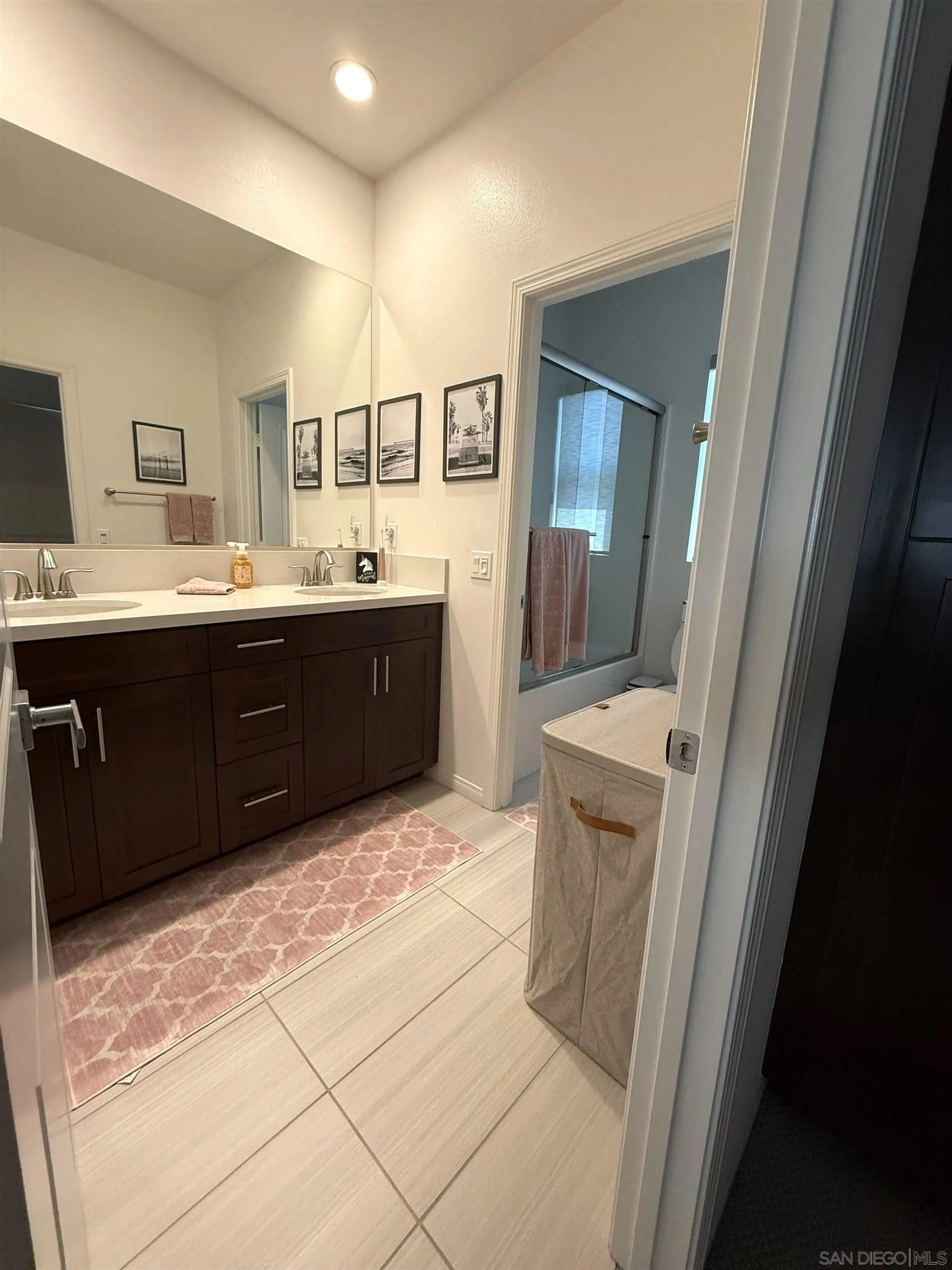8515 Goldfield Street Santee, CA 92071 - Photo 12 of 34 a spacious bathroom with a vanity a sink a mirror and a bathtub