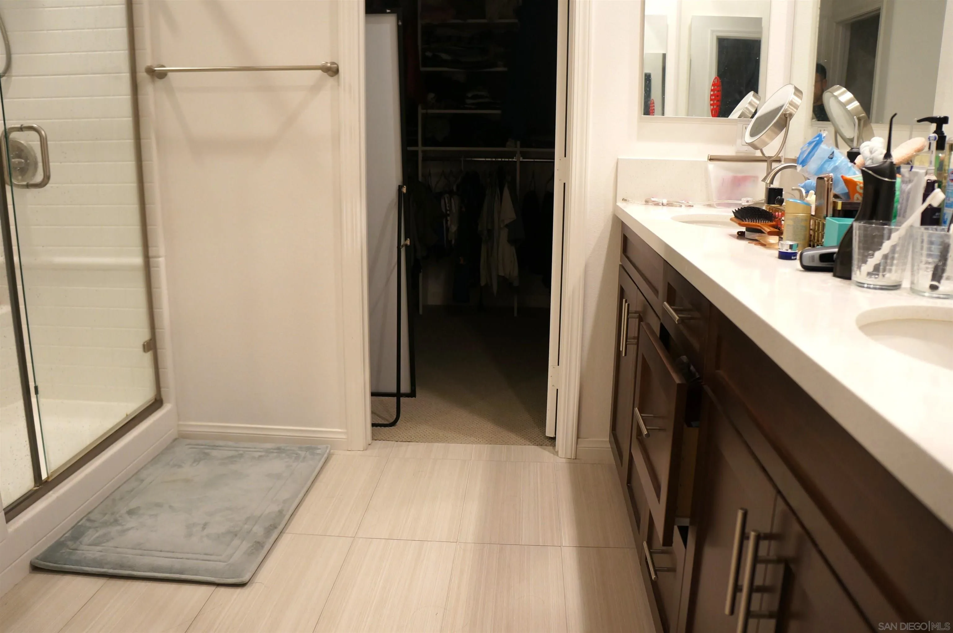 8515 Goldfield Street Santee, CA 92071 - Photo 14 of 34 a bathroom with a sink and a mirror