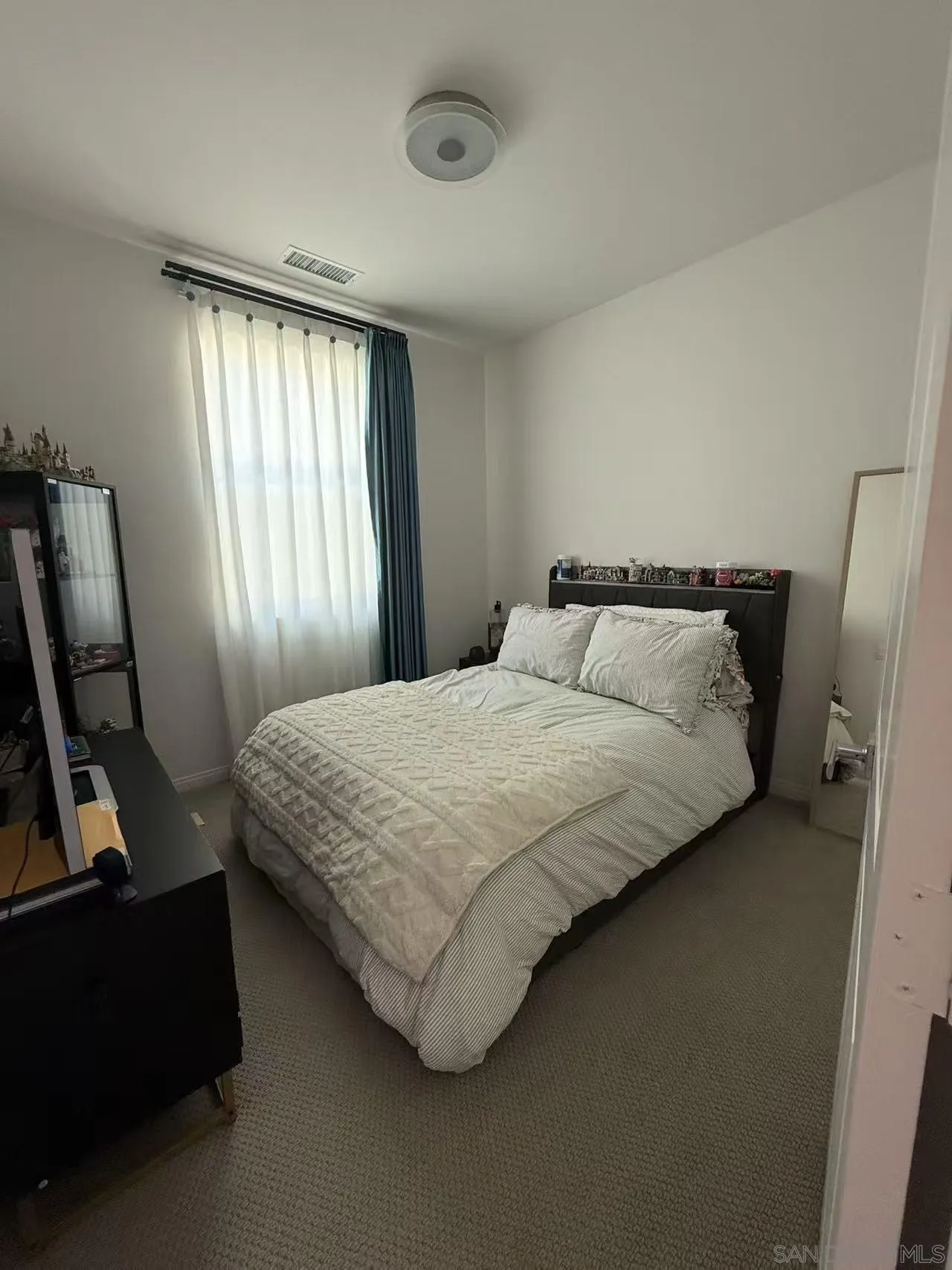 8515 Goldfield Street Santee, CA 92071 - Photo 18 of 34 a bedroom with a bed and a window