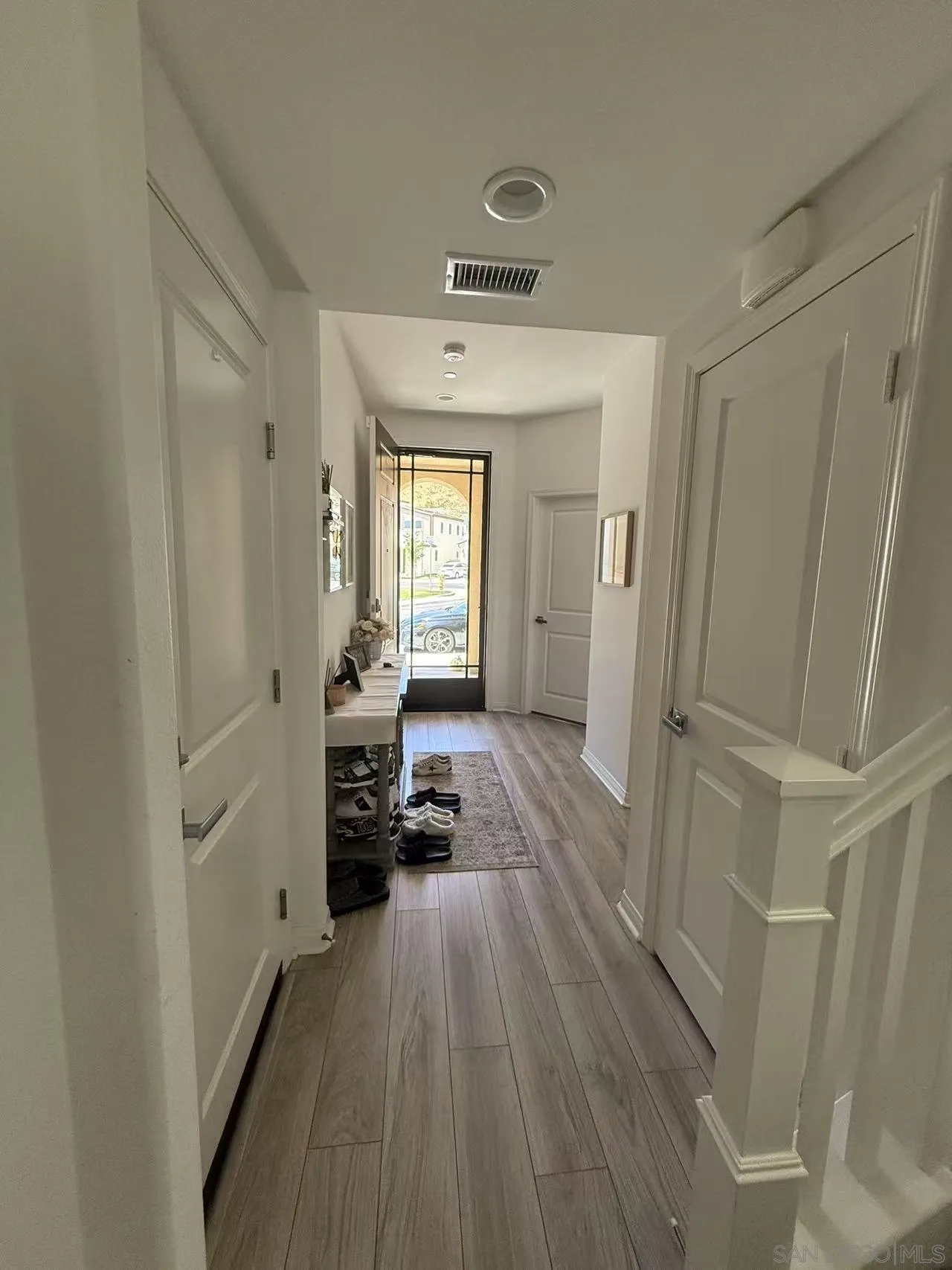8515 Goldfield Street Santee, CA 92071 - Photo 21 of 34 a view of a hallway view with a wooden floor and a sink